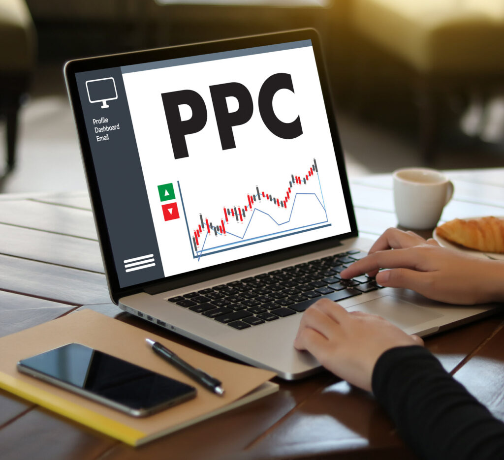 PPC - Pay Per Click concept businessperson working on laptop