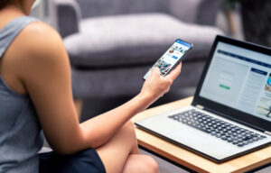 A woman browsing LinkedIn on her phone