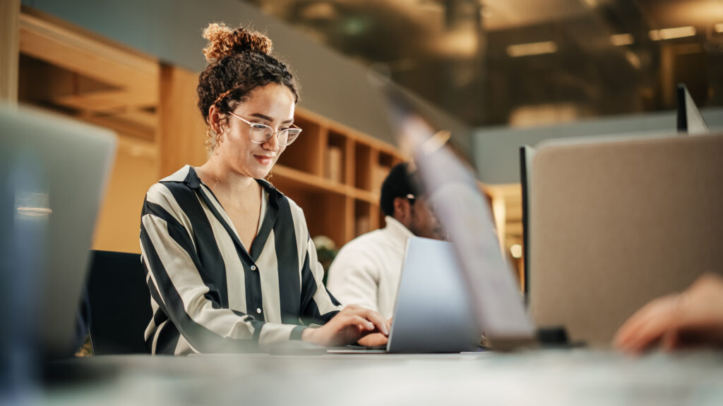 Woman typing on laptop