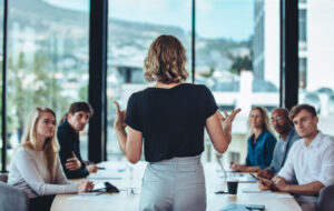 Business woman speaking to room